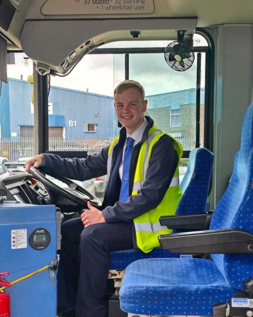 Luke Davies sat in the cab of a bus