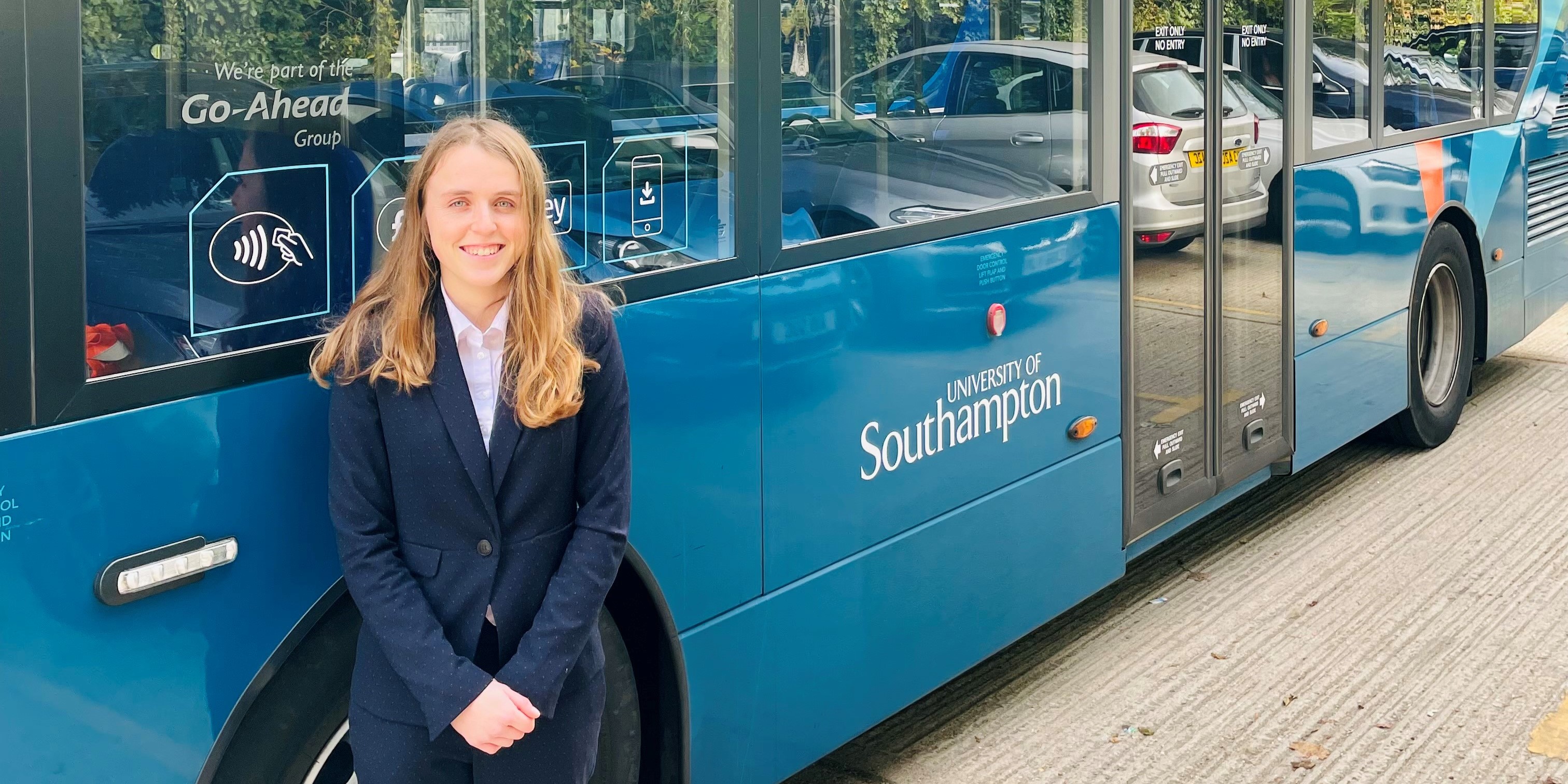 Rachel Perkins, Bluestar Assistant Operations Manager and Unilink Manager next to Unilink bus.