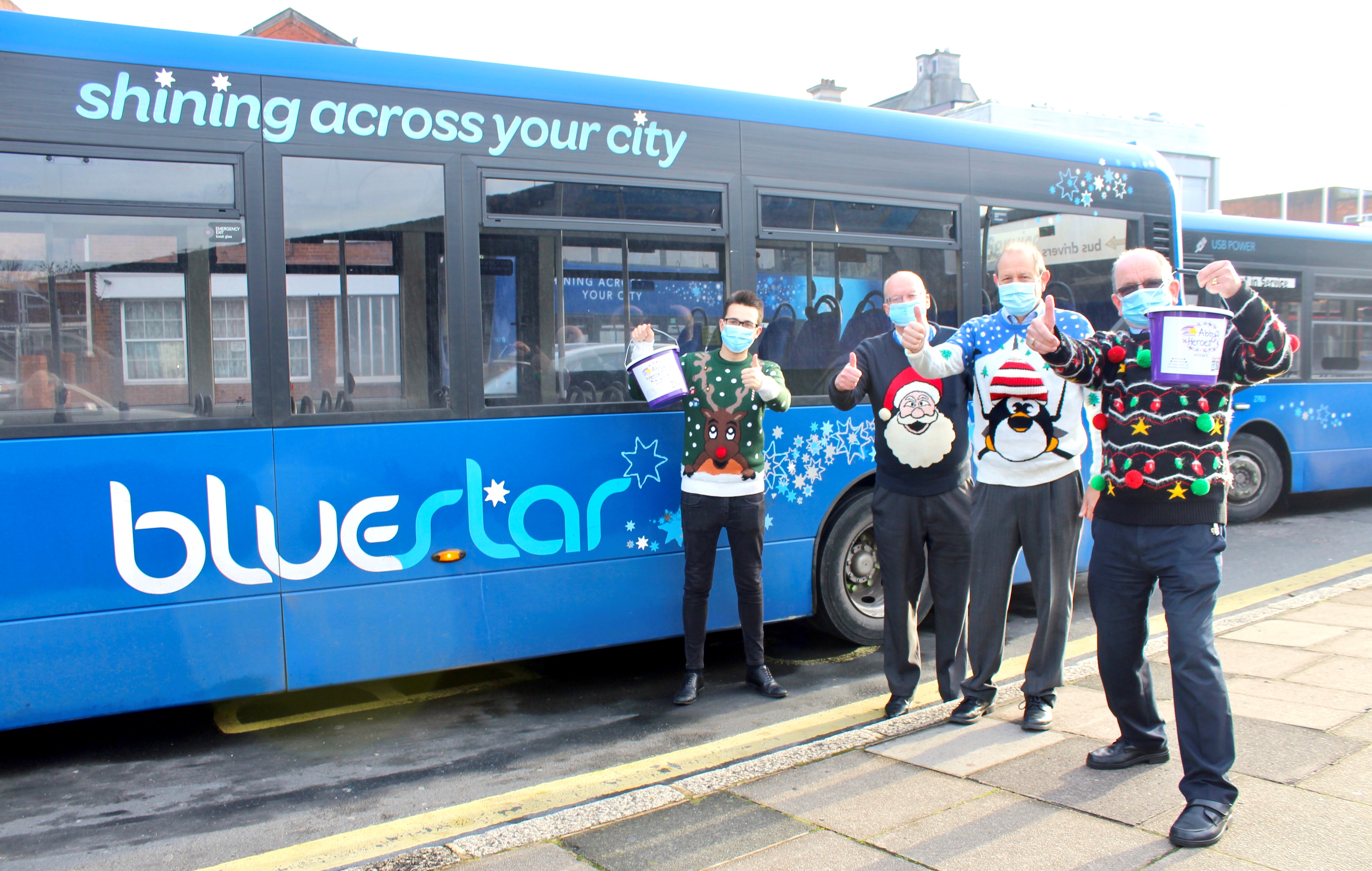 bus drivers wearing christmas jumpers